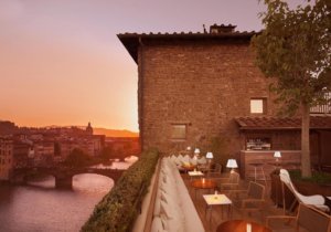 Arno river and florence at sunset, seen from La Terraza rootop bar in Florence, Italy