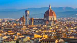 Florence Duomo seen from above, with city buildings around it 