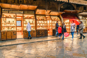 Interior passage with plenty of luxury stores at famous ponte vecchio in florence city, Italy