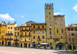 Medieval buildings and tower in Arezzo, one of the best cities to visit on a trip to Tuscany